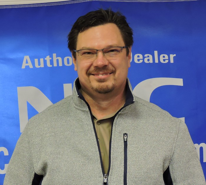 Michael, owner of Total BC Solutions. A fair skinned man with a goatee, short dark hair, and glasses.