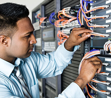 A man performing a free technology assessment of an IT system.