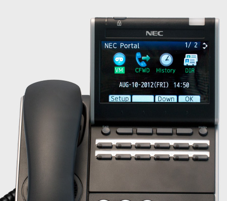 A NEC telephone with menu items shown.