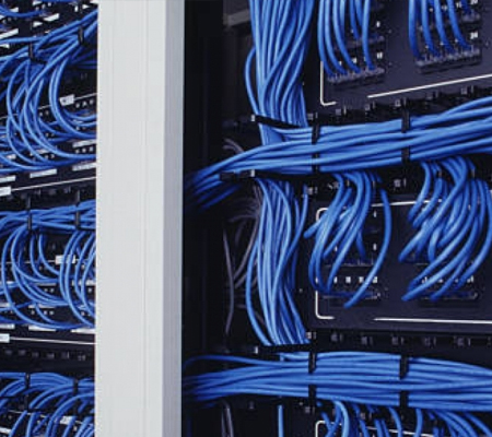 Tons of Blue cables in a wall panel